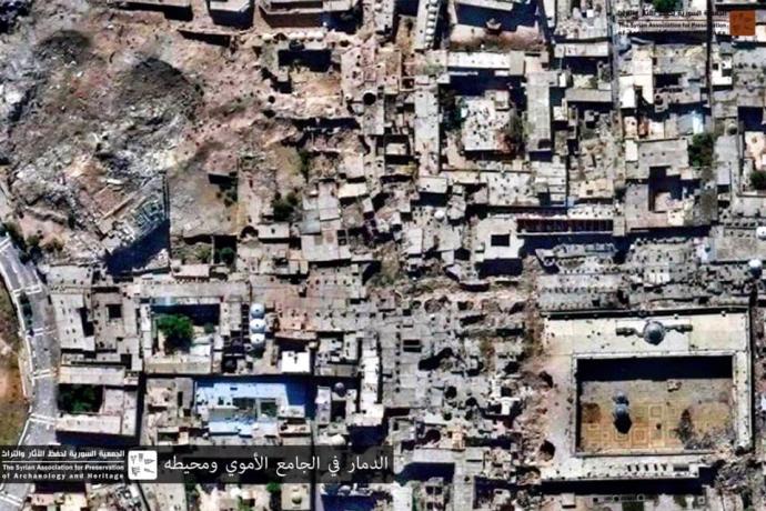 مرفق 3 - صورة جوية تظهر الدمار الواسع في محيط الجامع الكبير أواخر عام 2014.jpg