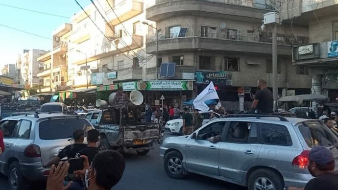 مسيرة لتحرير الشام في ادلب فرحاً بانجازات طالبان.jpg