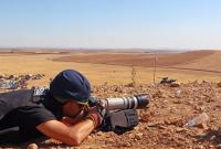 syria-journalist-photographer-camera-attacks-violations-conflict-getty.jpg