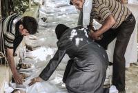 child-mother-father-body-chemical-weapons-attack-suburbs-august-21-2013.jpg