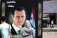 ملصقات دعائية لرئيس النظام السوري بشار الأسد في دمشق - أيار 2021 (AFP)