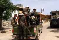 صورة أرشيفية لعناصر من قوات النظام السوري (AFP)