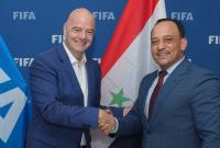 رئيس "الفيفا" جياني إنفانتينو مع رئيس الاتحاد السوري لكرة القدم صلاح رمضان (الوطن)