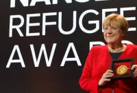 أنجيلا ميركل تتسلم جائزة نانسن للاجئين في جنيف - رويترز