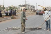 رجال ونساء يعملون في بلدية حلب (الإنترنت)
