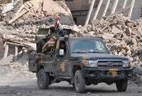 سيارة عسكرية لقوات النظام السوري في مدينة درعا - AFP