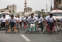 فلسطينيون تسبب الاحتلال الاسرائيلي بإعاقتهم يتنافسون ضمن سباق ماراثون خصص للاحتفاء باليوم العالمي لذوي الاحتياجات الخاصة