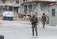 حاجز لقوات النظام السوري في حي درعا البلد - AFP