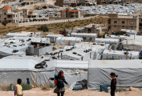 مخيم للاجئين السوريين في بلدة عرسال الحدودية شرقي لبنان - أسوشييتد برس
