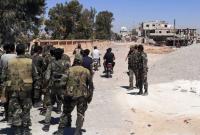عناصر من قوات النظام السوري في ريف درعا - AFP