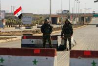 حاجز لجيش النظام السوري في دمشق (رويترز)