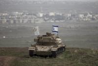 دبابة إسرائيلية في الجولان السوري المحتل (رويترز)