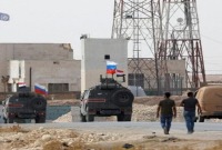 قوات تابعة لـ روسيا ونظام الأسد في ريف الحسكة (رويترز)