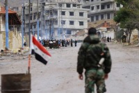 حاجز لقوات النظام السوري في ريف دمشق (أرشيفية/AFP)