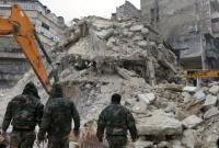 مبنى مهدم في مناطق سيطرة النظام السوري (AFP)