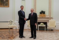 بشار الأسد يصافح الرئيس الروسي في الكرملين - 15 آذار 2023 (رئاسة الجمهورية)