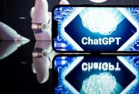 شعار "ChatGPT" على شاشة عرض (AFP)
