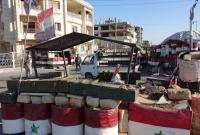 حاجز لقوات النظام في مدينة درعا (AP)