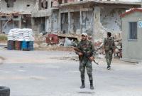 حاجز لقوات النظام السوري في درعا (AFP)