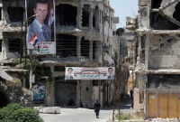 مبان مدمرة في مدينة حمص (رويترز)