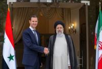 بشار الأسد يلتقي الرئيس الإيراني إبراهيم رئيسي في طهران - 8 أيار 2022 (قناة العالم)