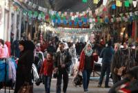 سوريون يتسوقون في سوق الحميدية (أرشيفية/AFP)