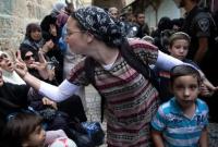 مواجهة بين امرأتين إسرائيلية وفلسطينية خلال مظاهرة في البلدة القديمة بالقدس المحتلة (أرشيفية - رويترز)