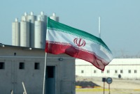 العلم الإيراني في محطة بوشهر للطاقة النووية - AFP
