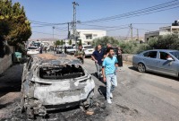 جانب من الخراب بعد هجوم مستوطنين إسرائيليين على بلدة ترمسعيا شمال رام الله، الضفة الغربية المحتلة، 21 حزيران/يونيو 2023 (AFP)