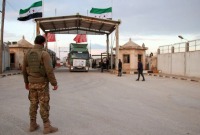 شاحنات تحمل مساعدات تدخل شمال غربي سوريا عبر تركيا – AFP