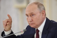 الرئيس الروسي فلاديمير بوتين خلال المؤتمر الصحفي في سان بطرسبورغ، 29 تموز 2023 (رويترز)