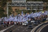 مسيرة احتجاجية حاشدة ضد حكومة نتنياهو و"تعديلاته القضائية" | صور