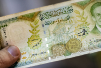 عملة ورقية من فئة 1000 ليرة سورية - AFP