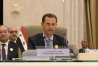 بشار الأسد يلقي كلمته خلال اجتماع القمة العربية في جدة - 19 من أيار 2023 (رويترز)