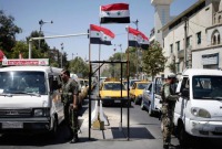 حاجز لقوات النظام السوري في العاصمة دمشق (AP)