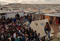 لاجئون سوريون يتجمعون في مخيم دوميز في إقليم كردستان العراق (OCHA)
