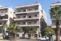 المبنى الذي اصطدمت به الطائرة المسيرة بحي السريان الجديدة في حلب (فيس بوك)