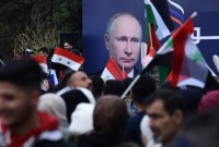 مسيرة في مناطق سيطرة النظام السوري داعمة لروسيا عقب غزوها لأوكرانيا - 10 آذار 2022 (AFP)