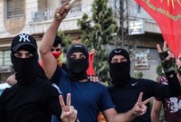 عناصر من "الشبيبة الثورية" في مظاهرة بالقامشلي - تموز 2023 (Radio Rojava)