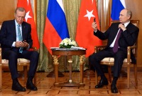 الرئيس التركي رجب طيب أردوغان يلتقي بالرئيس الروسي فلاديمير بوتين خلال زيارته الأخيرة إلى موسكو (موسكو)