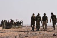عناصر من قوات النظام السوري وميليشياته في بادية دير الزور