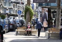 لافتات تحمل صورة رئيس النظام السوري بشار الأسد في شوارع العاصمة دمشق- أيار 2023 (AFP)