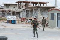 نقطة تفتيش لقوات النظام في درعا - AFP