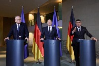 German Chancellor Olaf Scholz, Minister President of Hesse Boris Rhein and Minister President of Lower Saxony Stephan Weil