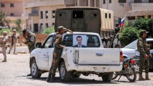 عناصر من قوات النظام السوري في درعا (AFP)