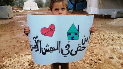 syrian-child-with-sign-750x563.jpeg
