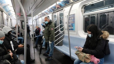 covid-19-coronavirus-people-in-face-masks-ride-the-subway-in-new-york-ap.jpg