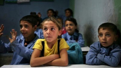syrian_refugee_students_sit_in_their_classroom_at_a_lebanese_public_school._ap.jpg