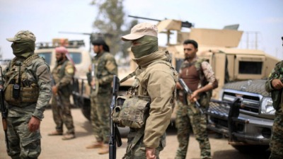 عناصر من قوات سوريا الديمقراطية "قسد" (رويترز)