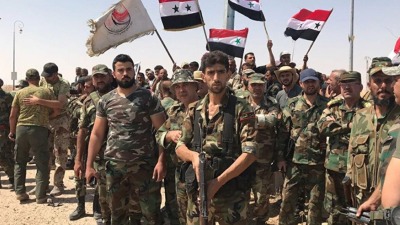 عناصر تابعين لجيش النظام وميليشيا "الدفاع الوطني" في درعا (سبوتنيك/أرشيفية)
